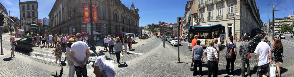 The iPhone's panorama function isn't really designed to capture movement. Maybe you can see the one-legged tourist, or the Aston Villa supporters' club bus?