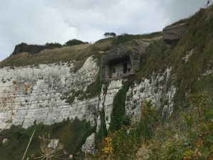 The remains of a wartime bunker exposed as the cliff face falls away